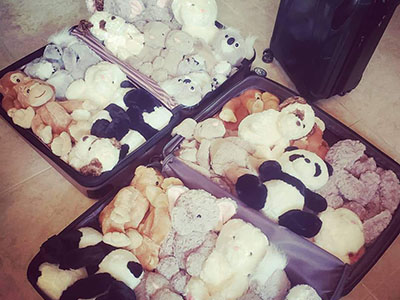 suitcase of little hugs stuffed animals headed for Bahamian children following hurricane dorian