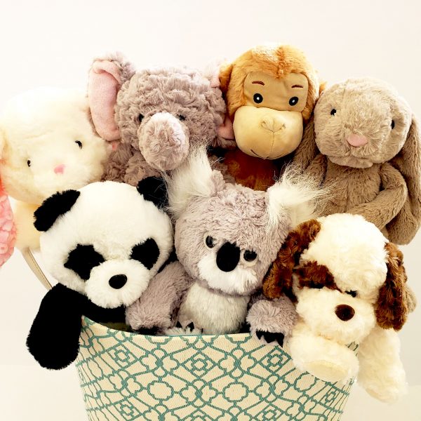 basket of several stuffed animals from little hugs