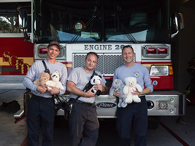 Statin 26 firefighters with little hugs stuffed animal plushies