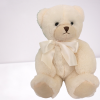 white teddy bear with ivory bow